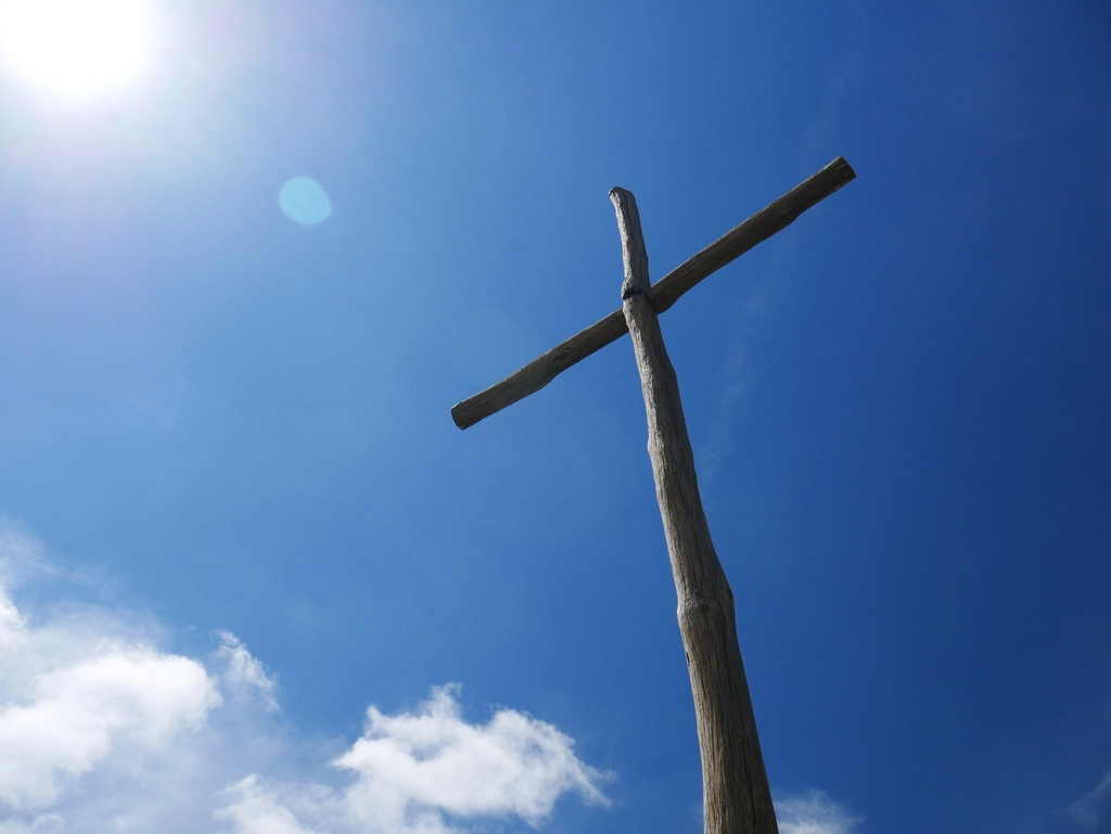 Free wooden cross, blue sky